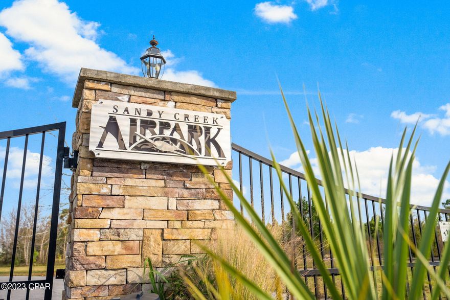 What an exciting opportunity to own a lot in private, gated Sandy Creek Air Park.  This .628 acre lot is perfect to build your custom home and airplane hangar.  Sandy Creek Air Park offers a 3200 feet paved private runway that is lighted dusk to dawn, has a green-white beacon and is designated by the FAA as 75L on the New Orleans sectional chart. There is also a clubhouse that is under remodel.  Conveniently located near Tyndall AFB, Panama City and the beaches of Panama City Beach, Mexico Beach and Port St. Joe Beach.  Don't miss this chance to live in a fly in/fly out community where you can taxi from your driveway right to the runway!  HOA fees are $650 per year which include the electronic entry gate, clubhouse and common area upkeep. You can also have your individual lot mowed for an additional $595 per year.