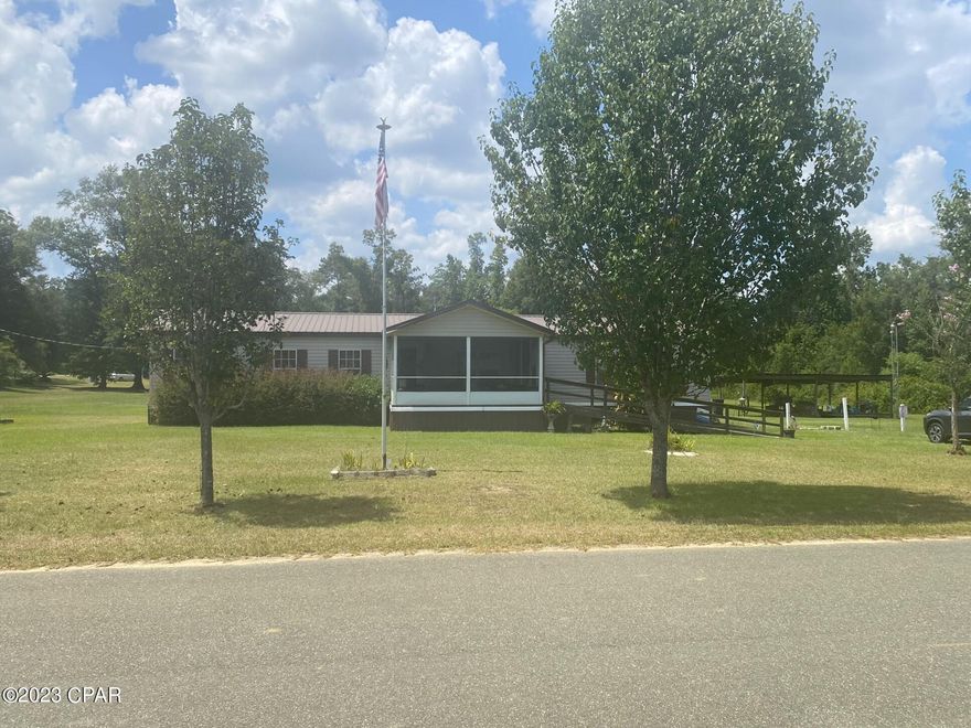 This home on 2.5 acres is located on the west side of Marianna. Handicap accessible!! Open floor plan from family room to kitchen to breakfast nook. Huge master bedroom with ensuite with double vanity and separate tub and shower.  AC is 3-4 years old, roof replaced  in 2016, $80,000 solar panel, with back up battery included in this price!! Electric runs about $18 per month, recent laminate flooring in most of the home. Great location just off Hwy 90 on a paved road.