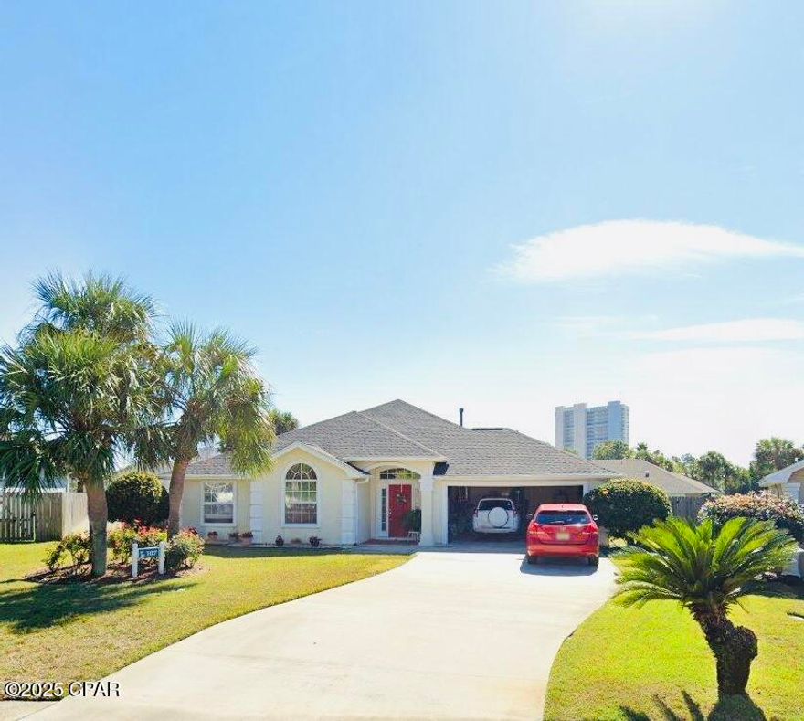 Welcome to this spacious, custom-built home in the highly desirable Summer Breeze neighborhood, just a short walk from the pristine white sandy beach and McGuire's Irish Pub. This golf-cart friendly community is known for its warm neighborhood feel and lively social events, making it a perfect place to call home.  Ideally located just minutes from Pier Park, restaurants, Dolly Parton's Pirate Voyage, Top Golf, shopping, and countless activities, this home also offers convenient access to the airport. Designed and built by the original owner, this home is ready for a new chapter. While it does need some updates, it presents an exciting opportunity for buyers to add their own personal touch and create their dream space. Inside you will find a well-thought-out floor plan featuring a gas log fireplace in the living room, seamlessly connecting to the kitchen and dining area-perfect for gatherings. The primary suite is a private retreat with a large walk-in closet, jetted garden tub, separate shower, and plenty of counter space. A large bonus room off the primary suite provides endless possibilities -whether you need a home office, gym, or media room. The outdoor space is an entertainer's paradise!  Enjoy gatherings on the 10' X 28' covered porch with finished flooring and plumbing for a summer kitchen.  Rinse off in the outdoor shower with hot and cold water after a day at the beach and appreciate the convenience of motion-sensor security lights in both the front and back. The sprinkler system, complete with its own well and timer, keeps the landscaping pristine. A 12 X 12 stucco workshop with electricity provides extra space for hobbies or storage. With a newer roof (approx. 4 years old) HVAC system (2016), and water heater (2018) this home is well-maintained. This spacious, well -designed home is packed with opportunity - don't miss out on this rare gem in Summer Breeze waiting for your personal decorating touch. Whole house water softener. Termite warranty is transferable. Shared fence. Dishwasher not working. All measurements are approximate. If important, please self-measure.