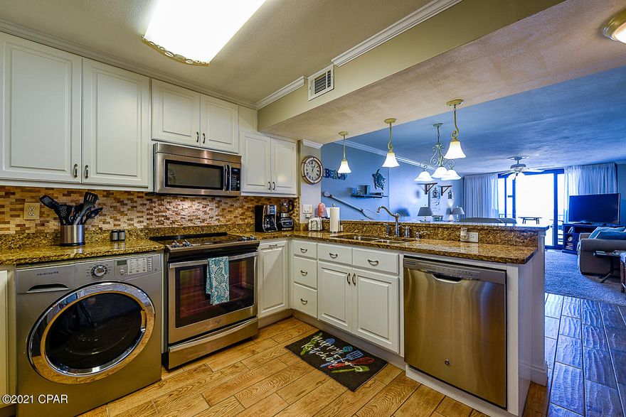 THIS GULF FRONT , COMPLETELY REMOLDED 2 BEDROOM, 2 BATHROOM CONDO IS MOVE-IN READY.  BEACH AND SUNSET VIEWS ARE UNMATCHED.  CONDO IS PERFECT FOR YOUR PRIMARY HOME, SECOND HOME OR WOULD MAKE A PERFECT RENTAL UNIT.  DUNES OF PANAMA OFFERS THREE POOLS, A TENNIS COURT, TIKI BAR AND MANY OTHER AMENITIES.  UNIT IS OFFERED FULLY FURNISHED.