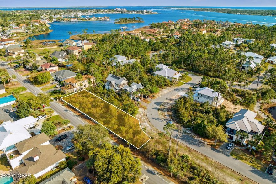 Discover the perfect canvas for your dream home in the exclusive Martinique gated community. This oversized lot, nestled on a tranquil backstreet, boasts twice the depth of typical neighborhood lots. Enjoy the perks of this inviting community, offering a pool, serene ponds, scenic walking trails, a playground and a basketball court for endless recreational opportunities. Beyond your new property, you'll find the convenience of a nearby marina and a array of restaurants, all within easy walking distance.