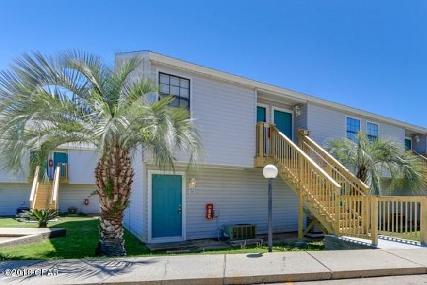 Adorable beach living at its finest! This affordable furnished studio is located just steps to the World's Most Beautiful Beaches. Highlights include updated flooring, fresh paint and a covered back patio. This spacious unit provides a generous amount of comfortable living space. Enjoy a day relaxing by the pool or take a walk on the dock to feed the fish in the beautiful fresh water lake. Take a short afternoon stroll to the white sandy beaches to watch the breathtaking sunsets on the Gulf of Mexico. Conveniently located close to Pier Park, shopping and some of the best dining the beach has to offer. Don't hesitate, call and schedule a showing today!