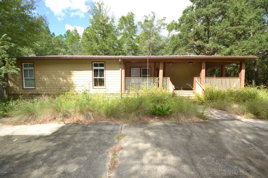 Love the Country, but enjoy the beach?  This could be the perfect place. This 3 Bedroom 2 Bath home is Located in Ebro Florida, Just a short drive to Panama City Beach.  The home features a large front covered porch, Open floor Plan, Large Kitchen with plenty of Cabinet and Counter Space and a huge  Master Bedroom with walk in closet.  The lot is 1 acre with plenty of shade.  The home needs some work, however would make a great starter home, investment property or 2nd home.  Schedule a visit today.  All Ages, measurements and room sizes are approximate.  Please verify if important.