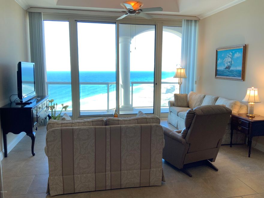 Spectacular penthouse unit in Tower 1 of the Portofino Island Resort!  Bask in the beautiful views of the Gulf of Mexico from this two bedroom, two and a half bath condo with its spacious balconies, twelve-foot ceilings, and split-bedroom floor plan!  This peaceful 21st floor unit (no short-term rentals allowed on this floor!) can be your getaway haven from the hustle and bustle of life.  Situated in a five-tower resort with every amenity you could wish for!  Each tower has its own swimming pool and hot tub.  Add to that your access to the hub which includes sauna, steam, locker room, full day spa, two restaurants, an indoor, Olympic-sized heated pool, convenience store, and gift shop! (Buyer should confirm all measurements.)