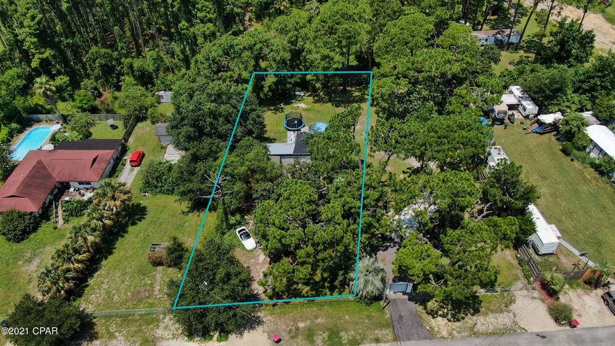 OVERSIZED LOT IN PCB!! Located in the up and coming Pines subdivision- a lot of new construction gone up in this area, and will be going up across the street, per the seller. If you have been looking for a place to build your new home, or to invest in multifamily, look no further. this area is zoned for multifamily/duplexes, making this an all around sound investment. No value given to the structure- all value is in the land. Go take a look today!  All information contained in this listing is presumed to be accurate- if important, buyer must verify all info!