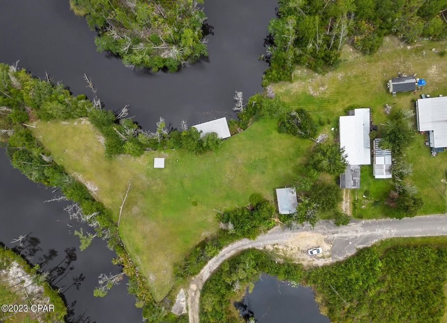 Looking to build your perfect dream home on Wetappo Creek? Property offers 1.18 acres on the water and is two parcels. There is a mobile home on one lot and the other is vacant and has a boat house on the property.