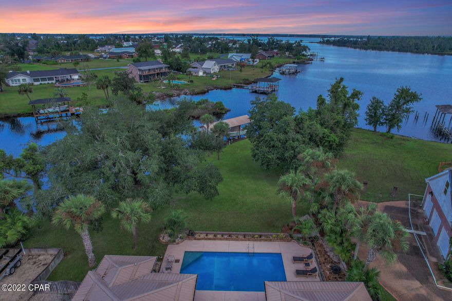 Florida living at it's finest! This beautifully renovated home is seated on more than 3/4 acre of pristine waterfront property in College Point. Over 150ft of waterfront with gulf access, large canal, boat lift, inground pool, NO HOA and a beautifully renovated interior! This home boasts 5 bedrooms, 2 bathrooms, formal and informal dining areas, an open floor plan and gorgeous water views throughout. Step outside the large back door to a covered entertainment area overlooking the pool, gorgeous oak tree and beautiful bay front. Off the canal you will find a large boat lift with boat house and room for additional jet skis, kayaks and other outdoor toys! This property really has it all. Call your realtor today to schedule a private tour! This home is newly renovated. New roof 2016. New AC Unit with purifier installed internally for allergies. New flooring, paint, ceiling fans, sprinkler system in yard, quartz countertops and more. New window treatments throughout home. 10,000 pound boat lift with new cradle and cables 2022.

There is a RING security system installed in the home which includes a sensor on all windows and doors. The exterior RING security cameras do not convey.