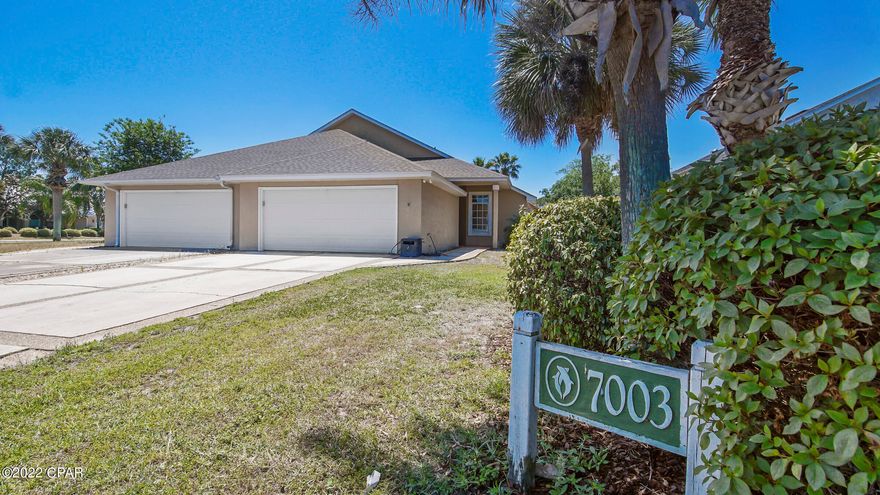 ** DOLPHIN BAY - GATED COMMUNITY ** One-level, low maintenance living with FRESH PAINT * NEW CARPET * TURNKEY This 3BR/2BA garden villa with NO STAIRS includes a 2-car garage has had a little freshening up and is ready for a new owner! Lovely home with vaulted ceilings, large walk in closet, large primary bath with double vanities, garden tub & shower, and a super quaint screened in porch & relaxing backyard. Dolphin Bay is a gated community featuring Tennis Courts, Marina, Picnic Area & Dock. Great location just minutes from everything the beautiful beaches of Bay County has to offer!