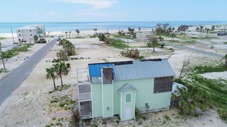 Opportunity in Mexico Beach! Designed to maximize outdoor space, the floor plan of this 3 bedroom home is ideal for beach living. The first floor features an open living/dining/kitchen area, as well as bedroom with its own sunroom, which leads to the pool. The second floor is home to the master bedroom featuring an expansive private balcony, as well as a guest bedroom with en suite bathroom. Both bedrooms on the second floor feature private outdoor space with stairs to the swimming pool.
