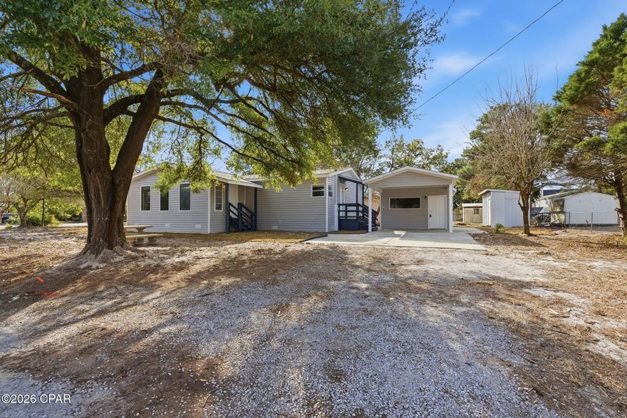 Located on Westwood Beach Circle on the west end of Panama City Beach, this fully renovated property offers a strong layout and location well suited for short term rental use, a second home, or full time living. Positioned just minutes from Lake Powell and a short drive to Seaside and the beaches of Panama City Beach, the property provides easy access to both coastal and recreational amenities.
Significant interior improvements include new drywall with a knockdown finish, fresh interior paint, updated baseboards, doors, and trim, and LVP flooring throughout. The remodeled kitchen features granite countertops, stainless steel appliances, and new cabinetry, and opens to a den with a wood burning fireplace. A bedroom with its own exterior entrance is located just off the den, offering a functional setup for guest privacy and rental flexibility.
Additional living areas include a sunroom, dining area, and flex space that can accommodate a second seating area or additional sleeping arrangements. The laundry room offers ample storage and folding space, supporting efficient turnover and longer guest stays. The primary bathroom has been fully renovated and includes a tiled shower with glass doors, a soaker tub, and a double vanity.
Major system upgrades include a new HVAC system, new water heater, and new roof. Exterior improvements include new vinyl siding, fresh sod, an outdoor shower, and a storage shed that works well as an owner's locker or for storing kayaks and beach gear. A gazebo provides a comfortable outdoor space for guests to enjoy morning coffee or evening sunsets.
A detached, split level bonus space adds additional rental or guest potential, featuring a bathroom, mini fridge, and space suitable for sleeping or living furniture. With multiple living zones, extensive updates, and a desirable west end location near Lake Powell, Seaside, and Panama City Beach, this property offers a versatile opportunity for buyers seeking a short term rental or coastal retreat.  Call a REALTOR® today to schedule a private tour. If important, please verify all measurements and information.