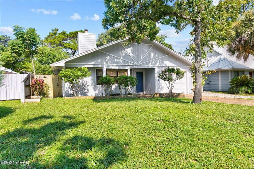 This charming home is in the beautiful  Open Sands neighborhood and is a 10 minute walk to the white sandy beaches of Panama City Beach and 2 miles from Pier Park.  The home has a new roof, new AC in 2019, and new vinyl planking throughout main areas of the home. There is a fireplace dividing the kitchen and living area. This home has newer exterior paint and a new privacy fence was just installed. This is a great area of PCB for a second home or a rental. (Short term is not allowed in this area)