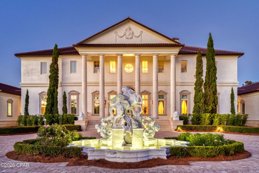Perched on 380 feet of pristine West Bay waterfront along the Northwest Florida Gulf Coast, Villa Chimera is the most extraordinary luxury estate in Panama City Beach. Spanning 9,473 sq. ft. across three expansive lots, this 5BR/6BA/4HB masterpiece was authentically modeled after an Italian Venetian Palazzo -- designed by architect Philip Spann from hand-sketched owner drawings inspired by Renaissance master Andrea Palladio. Every finish was sourced from Italy or crafted by world-renowned artisans: a hand-carved Italian marble fountain, cushion-cut marble walls, Venetian silk upholstery, a Rome-crafted stone dining table, and a Renaissance fresco ceiling hand-painted by artist Jody Matokovich. This is not simply a Gulf Coast luxury home -- it is a one-of-a-kind legacy estate.

The soaring foyer commands immediate attention with its grand Schonbek crystal chandelier, custom compass rose marble floor inlay, and solid stone staircase with marble balusters. The great room overlooking West Bay features a marble fireplace, limestone accents, and walls upholstered in Bevilacqua silk -- made in Venice and renowned worldwide. A media room with a theater-size projection screen and theatrical lighting flows seamlessly from the living space.
The gourmet kitchen features Wolf and Sub-Zero appliances, a breakfast bar, separate bar area, and a fully equipped butler's pantry for effortless large-scale entertaining. All cabinetry was custom-designed by Design Galleria of Atlanta. The dining room centers around a custom stone table crafted in Rome outside the Vatican walls, beneath Venetian watermark plasterwork evoking centuries of Palazzo history.
The second-level master suite is a private sanctuary with bay views, a columned balcony, and a hand-painted Renaissance fresco vault ceiling. Separate his-and-hers bathrooms each feature heated floors and double showers with body jets. A detached guest house -- connected by covered walkway -- includes a full kitchen, sitting area, private veranda, and full bath.
Smart home living is delivered via a full Crestron system controlling all lighting, media, and security. Additional highlights: Kohler 100KW whole-house generator, all-copper plumbing, 4-car garage with wheelchair lift, whole-house central vacuum, monitored security cameras, LED lighting throughout, and all windows and exterior doors replaced post-Hurricane Michael. A rare and irreplaceable Florida Gulf Coast waterfront estate -- schedule your private showing today.