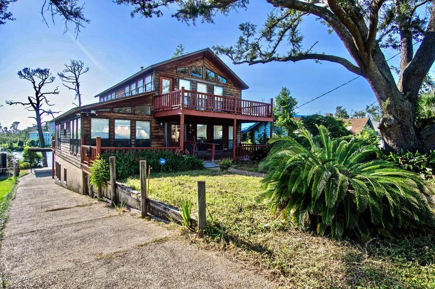 Waterfront living at an affordable price! This 4 bedroom/ 3.5 bathroom home boast over 3,800 square feet of heated and cooled space. With three stories, two kitchens and balconies off the second and third floors it's easy to enjoy water views of the bayou from either floor. Perfect for an investment or a forever home and already remediated ready for you to make it your own. You'll enjoy the 3rd floor master bedroom with ample space, his and her closets and a private balcony. Highlights include, a covered carport, dock slips, spacious laundry room, two bedrooms with water views and private baths and plenty of windows that allow the natural light to flow throughout the large floor plan. Each kitchen has plenty of cabinet pace, counter-space, breakfast bar and has a dining area. You don't want to miss this opportunity. Call today fro your showing!