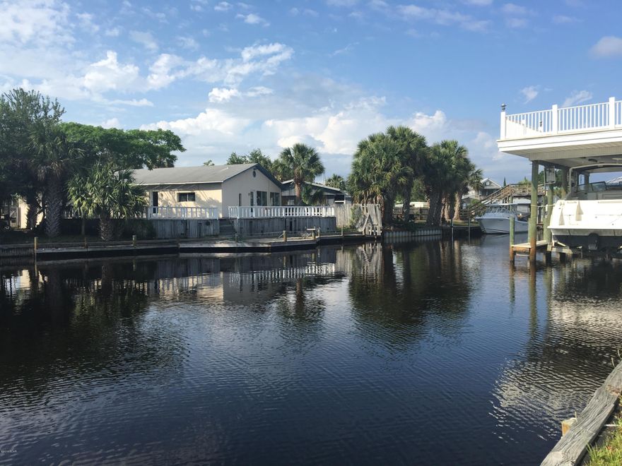 Level, cleared waterfront lot. 45-FEET ON THE CANAL. This lot is inside a gated restricted subdivision offering its owners privacy and a protected waterfront canal for your dock and boat. You have 45' of water frontage which already has a seawall in place. The location is convenient to town and the beach. For the boater the protected lagoon puts you into St. Andrew Bay in 5-minutes and then you are just a short run to the Gulf of Mexico and Shell Island. Lot size approximate, please verify if important.