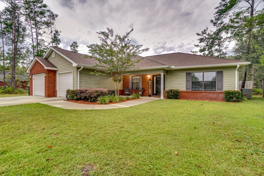 CURRENTLY UNDER CONTRACT, SELLER ACCEPTING BACKUP OFFERS. Get away from the crowd but still convenient to EVERYTHING! Have some space between you and your neighbor. Welcome to country living and in a quality subdivision with beautiful homes and abundantly large 1 acre + lots! This home has an open floor plan with split bedrooms. The kitchen boasts a large Silestone solid surface island breakfast bar separating the cozy living area from the modern kitchen featuring stainless steel appliances, large pantry, & solid wood cabinets. Enjoy the private large master suit. Your master bath features an over sized tub, his & her walk-in closets, double sinks, and a custom ceramic tile shower. The over sized garage opens into a large laundry/mudroom. A large flat back yard is privacy fenced. The rear property line backs up to 3,000 acres of timberland.