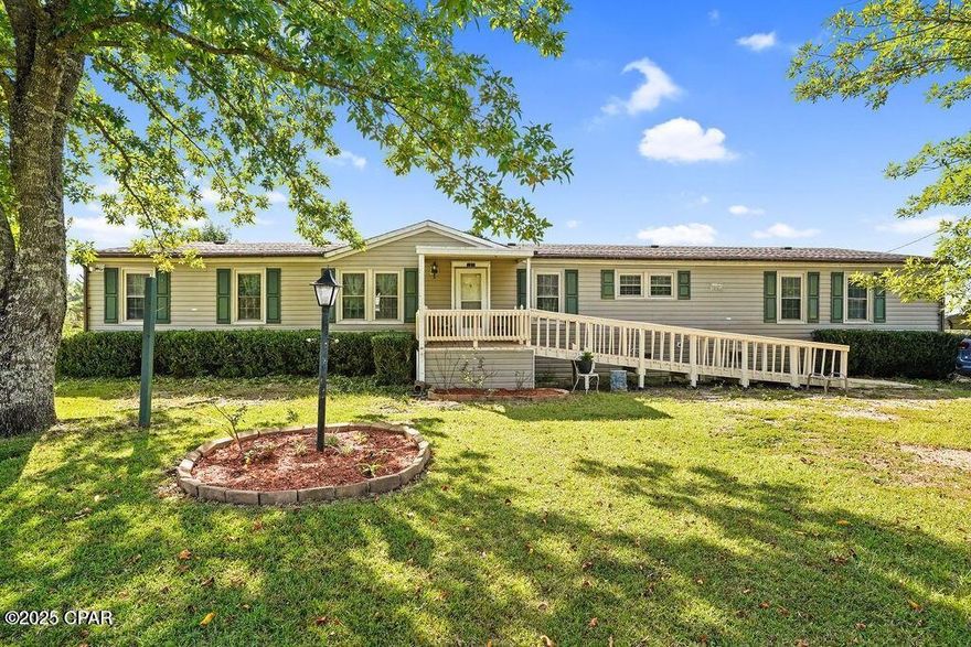 3BD/2BA Country Manufactured Home on 2.5 Acres - Updated with Butcher Block Table, Coffee Bar, Garden, Fruit Trees & Sheds!

Enjoy country living in this charming and thoughtfully updated 3-bedroom, 2-bath manufactured home set on 2.5 beautiful acres. This move-in-ready property features fresh paint throughout, brand-new insulation, repaired a newly insulated underbelly, new subflooring, and vinyl plank flooring in most of the home.

The kitchen boasts all-new cabinetry, a stunning butcher block island, and a matching butcher block dining table—perfect for family gatherings. A built-in coffee bar adds the cozy touch, creating an inviting space to start your mornings. Both bathrooms have been updated, and the porches have been refreshed—including a handicap-accessible front porch for added convenience. Each bedroom features a spacious walk-in closet, providing excellent storage throughout the home.

Outside, a limestone driveway leads you home to a setting that blends comfort and practicality. Approximately two acres are chain-link fenced, offering secure space for pets, children, or small farm life. A private, fenced 40 sq. ft. garden is ready for your green thumb, while the property boasts established blackberries, blueberries, strawberries, grapevines, olive trees, mayhaw trees, and several additional fruit trees. The back quarter-acre is separately fenced, making it ideal for small animals, horses, or livestock.

A remodeled well house provides added peace of mind, and two sheds (a small shed and a garden shed) convey with the property, offering plenty of storage and workspace.

This updated country retreat has the perfect blend of charm, functionality, and outdoor living. Don't miss your chance to own a peaceful, move-in-ready home with modern upgrades and room to grow — schedule your showing today!