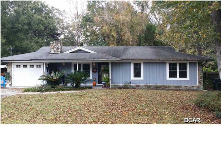 STOP!!! Here is a must SEE!!! Three or possible four bedrooms and across the street from Lynn Haven Elementary. This home shows that it has been well maintained and upgraded as needed through the years. From the moment you enter the Leaded Front Glass Door you are greeted by an open and warm environment, a wonderful wood burning fireplace is nestled into the corner of the living room. The kitchen has newer cabinets and appliances, both baths have been upgraded with gorgeous vanities, fixtures and tiled showers. The roof is only ten years old all the windows have been replaced with double paned windows that look great and add to the energy efficiency of the house. Large fenced and gated back yard on the 100'X100' lot. The garage is heated and cooled and could be easily renovated into