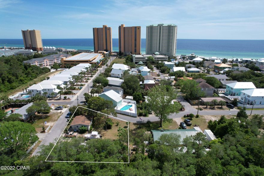 Back On Market Due to Buyers Financing falling through.  JUST REDUCED- CH- Commercial High Intensity Lot within 1000 feet of the beautiful Gulf-of-Mexico.  This lot is zoned for condos (44 units per acre, approximately 9 units), Triplex (1 unit per 3000 sq.ft.), Duplex, or a single detached family home and this location allows for vacation rentals. The beach cottage that is currently in place is habitable, and sellers live in it, but it needs some TLC. Value is in the land.  Highest and best use would allow for removing the current home in place and maximizing the 100x125 lot.  This area is surrounded by higher-end, new construction homes, and would be a beautiful place to build your dream home, or a wonderful investment for income producing properties. Homes in the surrounding area, on lots less than half this size have sold for over a million.   This lot is in a desirable location on the west end of the beach, within short walking distance to the Gulf-Of-Mexico with dedicated beach access at the end of the street.  Pier Park is only a 7-minute drive, where you can enjoy shopping, entertainment, or wonderful restaurants.  Zoning and planning documents and guidelines are uploaded in the MLS to help with buyers due diligence. If this sounds like the investment you have been waiting for contact your realtor today for a private showing before your dream of owning a piece of paradise becomes someone else's reality. Age, sq.ft., room dimensions, taxes, any valuable information is an estimate and must be verified by the buyer if important.