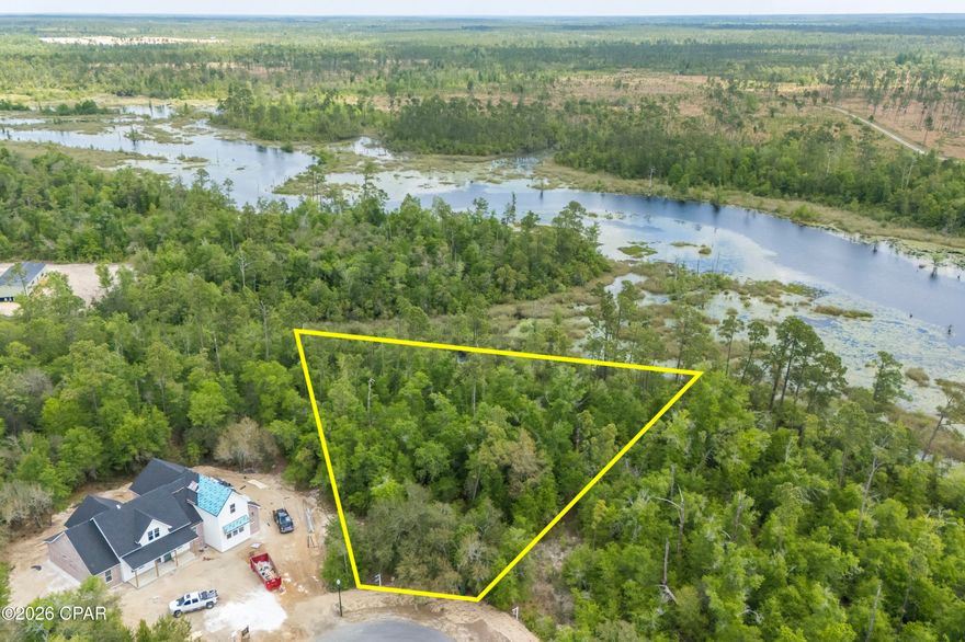 A rare opportunity to own a true hidden gem on Cedar Creek at Deerpoint! Nestled in a quiet, peaceful setting, this beautiful homesite offers the perfect blend of natural Old Florida charm and the comfort, security, and elegance of a thoughtfully planned community. Surrounded by stunning mature oak trees and lush native landscaping, the lot enjoys serene views overlooking cypress-lined waters and breathtaking sunset skies across the lake. The neighborhood is carefully designed down to the finest architectural and landscaping details, creating a cohesive and visually stunning environment -- the perfect backdrop to build your custom dream home.Residents enjoy exclusive gated access and exceptional community amenities, including a playground, a pool with bathrooms and pavilion, and a welcoming clubhouse ideal for gatherings and celebrations. Additional conveniences include a private mailroom, as well as beautifully maintained streets throughout. If you're looking for privacy, natural beauty, and upscale community living -- this is the homesite you've been waiting for. Build your dream home and experience the best of peaceful waterfront living. *Seller is offering a set of architectural house plans to go with the lot, site plan has been attached.