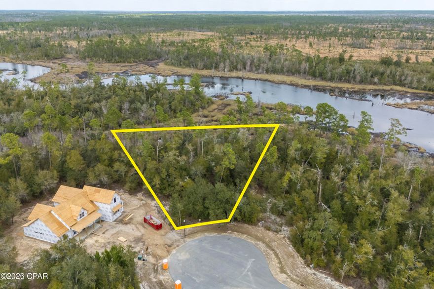 A rare opportunity to own a true hidden gem on Cedar Creek at Deerpoint! Nestled in a quiet, peaceful setting, this beautiful homesite offers the perfect blend of natural Old Florida charm and the comfort, security, and elegance of a thoughtfully planned community. Surrounded by stunning mature oak trees and lush native landscaping, the lot enjoys serene views overlooking cypress-lined waters and breathtaking sunset skies across the lake. The neighborhood is carefully designed down to the finest architectural and landscaping details, creating a cohesive and visually stunning environment -- the perfect backdrop to build your custom dream home.Residents enjoy exclusive gated access and exceptional community amenities, including a playground, a pool with bathrooms and pavilion, and a welcoming clubhouse ideal for gatherings and celebrations. Additional conveniences include a private mailroom, as well as beautifully maintained streets throughout. If you're looking for privacy, natural beauty, and upscale community living -- this is the homesite you've been waiting for. Build your dream home and experience the best of peaceful waterfront living. *Seller is offering a set of architectural house plans to go with the lot, site plan has been attached.