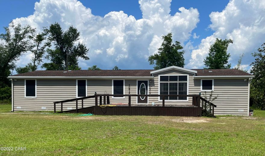 This home has a very spacious split floor plan and offers large living spaces with the living room, dining room and a den that has a wood burning fire place along with the 4 bedroom and 2 bathrooms. This home sits on over an acre of land in Bear Creek on a paved road less than one mile off Hwy 231.

 Wheel chair accessible ramp on front and back of home. The back of the home has a covered deck, the back yard behind the home is fenced in with a privacy fence. New roof in 2019, also there is a small storage shed in the side yard. All info and measurements are approx., buyer to verify all deemed important.