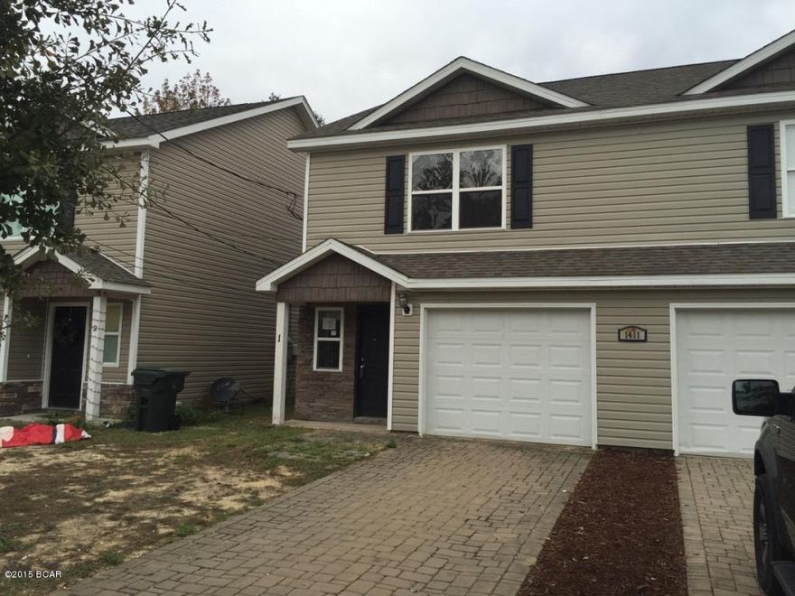 All measurements approx. 3 bedroom 2 1/2 bath townhome in the heart of Lynn Haven. This spacious executive style townhome features wood cabinets, lots of tile, stacked stone/vinyl exterior with brick paver driveways. Single car garage. Central location is close to schools and shopping. No association fees!