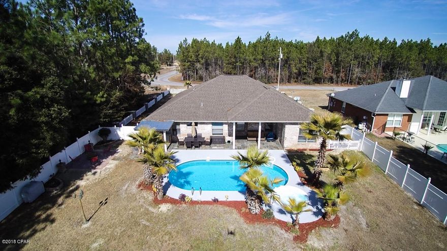 Beautifully constructed custom all brick home. Just 3.5 miles north of Panama City Mall at Pipeline Rd and Country Lake Dr.

Large 1+ acre lot offering privacy for your pool area and outdoor kitchen.

Interior is modern contemporary and offers all hardwood and tile flooring, solid wood cabinetry and granite counter-tops. Home offers spacious living areas, open large custom kitchen with breakfast room overlooking pool patio. In addition to the 4 bedrooms and 3 baths, there is a private office/dining room adjacent to the welcoming foyer. Your pool-hot tub patio area and covered backyard kitchen will offer hours of family enjoyment, backyard is fenced with vinyl fencing. Call for your private tour today!