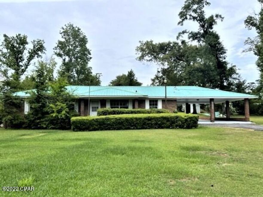 Looking for 4 bedrooms?   Here it is!   This is an updated 4 bedroom 2 bath home on large lot in 

lovely Dogwood Heights just north of town.  Location is close to Marianna High school, Marianna K-8 school and the MERE sports complex.  Home has all new stainless appliances in the large kitchen/dining area.  It has all vinyl plank and tile floors.  There is an attached 2 car carport, a wonderful large screened porch and a large den with fireplace.  All new gutters and downspouts were just installed.    Don't let this one get away!