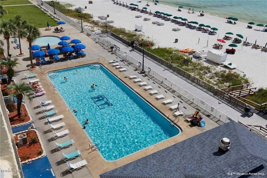 Fantastic property with great rental history! Waterfront with a view, Master located off of patio with patio access and view, faux hardwoods and tile in main living areas, large dining area. Repairs and updates have been completed for the entire property. Renovated full bar/snack shack, renovated heated pools, hot tub, gym, billiards, LIVE entertainment and family friendly movies in season. Full beach service on the sand!*