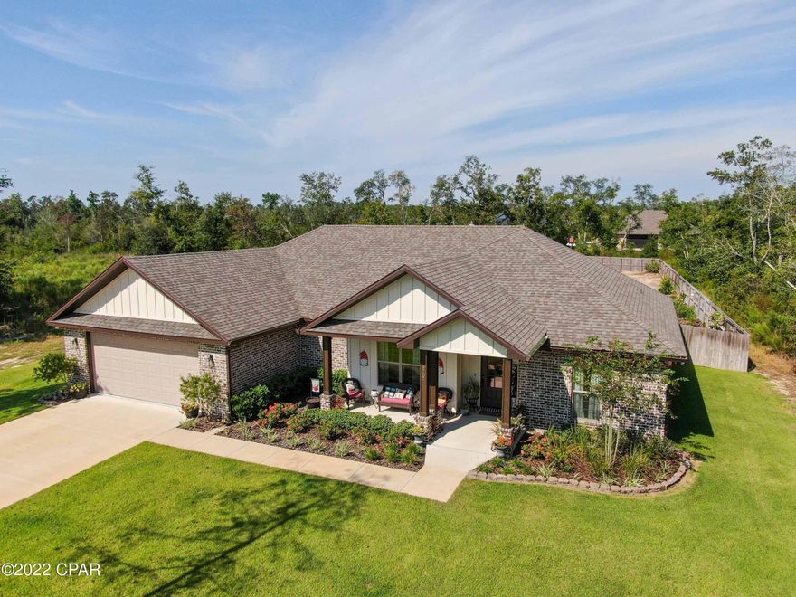 Immaculate custom built home located in desirable Cedar Creek at Deer Point Lake. You will fall in love from the time you pull into the driveway and surround yourself with the lush landscaping and water views of the lake. Open split floor plan with 10 Ft ceilings, brick entryway, crown molding, stunning quartz countertops throughout, LVP flooring and electric fireplace. Kitchen is a chef's dream. Cabinets with deep drawers, stainless steel appliances, large walk-in pantry, island that flows into living area. Oversized master bedroom with tray ceiling. Master bath features walk in shower, soaking tub, double vanities, linen closet and 10x9 walk in closet. Two bedrooms with a Jack-n-Jill bathroom.  Walk outside to a private oasis. Huge screened in back porch and covered insulated patio with pull down shades. Privacy fenced back yard surrounded by fruit trees, landscaping, garden and separate deep well for irrigation. 20x12 workshop with spray foam, window unit, 2 lofts and lean to behind shop. Oversized garage with storage space and spray foam insulation in ceilings. 
Cedar Creek at Deer Point offers a variety of amenities for all ages. The Creek House overlooks the lake, and the community room includes a living room, a private room for television, and a kitchen. Adjacent to the Creek House there's an outdoor fireplace, raised viewing gazebo and neighborhood pier. The Summer House and Pool features a children's playground, an outdoor summer kitchen and grill