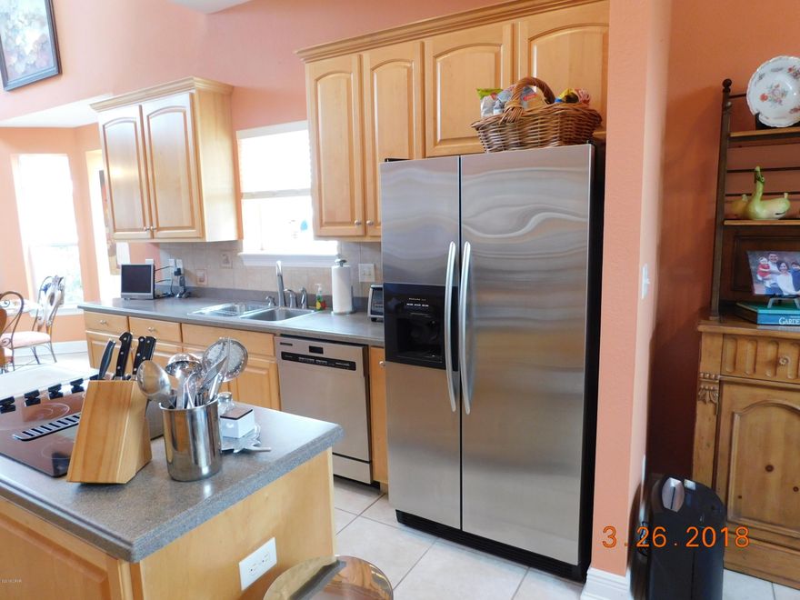 This is a 1 owner custom built water front home. 4 nice size bedrooms and 2.5 baths. Nicely landscaped exterior is inviting as well as the wonderful Lagoon views throughout the home. As you enter into the open foyer you will notice the Lagoon views right away. The 1st floor offers living room with built-ins and a wet bar with ice machine and sink, kitchen has lots of cabinets and corian like counter tops, nice Kitchen aid stainless appliance package with double oven and island jenn-air smooth top stove. Breakfast bar that seats 4 as well as a dining area. The kitchen area also has another sitting area/office space with build-in desk and lots of additional cabinets. The Living room,kitchen, master bedroom and 1 additional bedroom are waterfront.Master bedroom is accessible to the large deck Master has a private bath with cultured marble double vanity, walk in closet, Cultured Marble Jacuzzi tub and separate shower. The 2nd floor offers 3 additional bedrooms and a full bath as well as access to the 10x10 balcony overlooking the Lagoon, 2 of the bedrooms have walk-in closets. There is tiled floors throughout the 1st floor except for the master bedroom is carpeted , the stairway and landing and upstairs hall has wood floors 2nd floor bedroom have Berber carpet. This home was custom built with lots of extra features. There is a boat dock with lifts and boat house.