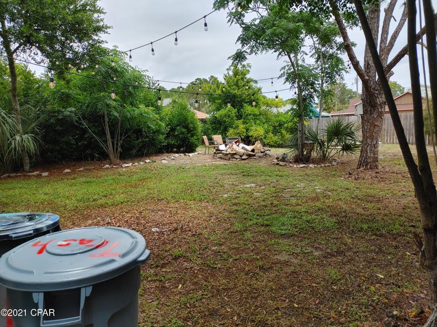 Easy walk to the beach from this cozy block home that features 2 bedrooms, updated bathroom, new LVP flooring, 50 year new metal roof, carport, huge fenced back yard and new septic lines in the last 4 years. Home does not have central heat and air, but the closet for the unit and vent holes in the ceilings are there and ready for that upgrade.