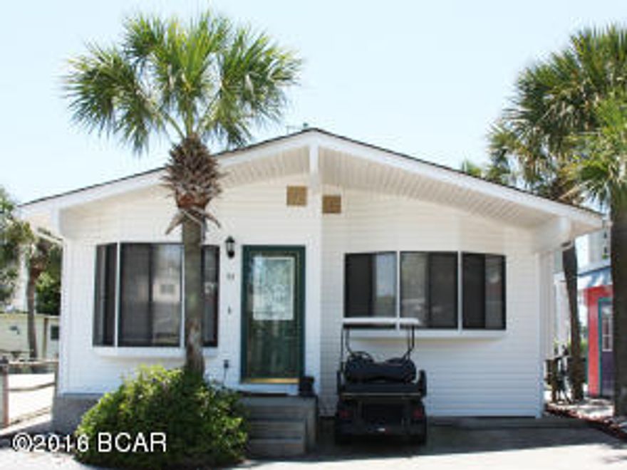 Great 3 bedroom, 2 bath home with an amazing location. The home is very close to the front of Venture Out resort, making your walk over to the beach a breeze. You will love the large kitchen with breakfast bar and good size living room. This home also features a great deck that would  perfect spot for outdoor grilling! It doesn't get better than this! Venture Out is a golf cart community that has 300' on the beautiful pristine beaches of the Gulf of Mexico and 1,000' on the Grand Lagoon. Venture Out has something for everyone. With two salt water pools (one heated), fishing pier, boat ramp, mini golf, children's play ground and much more.