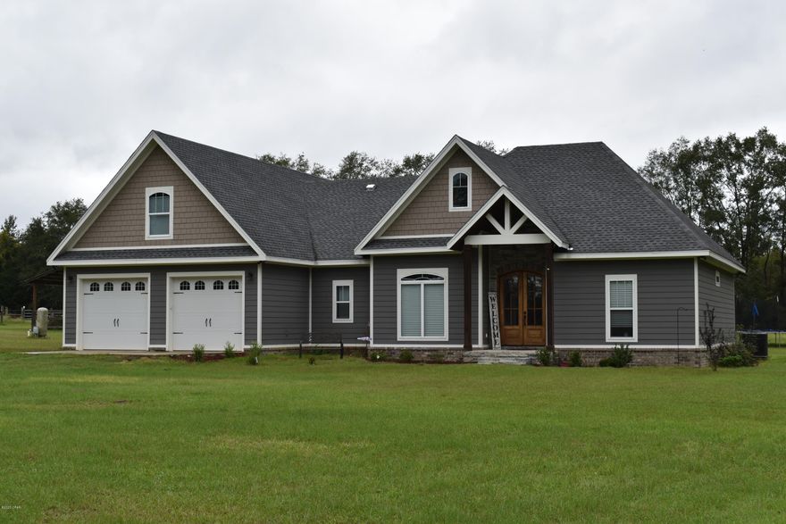WELCOME TO YOUR DREAM HOME!! This custom built 4 bedroom/ 3 bath craftsman style beauty features a open, split floor plan. Enter thru the front door into the foyer that boasts beautiful, unique brick paver flooring. From there you will walk into the spacious living room complete with cathedral ceilings, stone fireplace with electric insert and hickory hardwood floors that flow into the kitchen/dining area that features a large island with eat-in breakfast bar, granite counter tops, stainless steel appliances, oversized pantry with barn door and a custom wood range hood.  In the master bedroom you will find tray ceilings, master bathroom has double vanities, walk-in tile shower with separate soaking tub and a huge walk-in closet that is conveniently connected to the laundry room. Fourth bedroom/ bonus room is located upstairs complete with its own dedicated bathroom and would make a perfect mother-in-law suite or guest room. Outside you will find a nice covered back porch with ceiling fan and recessed lighting perfect for relaxing or entertaining family and friends.  All of this and so much more sitting on 4.05 acres complete with a 24'x24' pole barn with 12' lean-to. Don't miss out on this gorgeous home!!