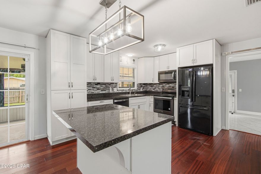 The Ultimate Move-In Ready Home.No HOA and no Flood zone. .Discover the perfect blend of durability and freedom in this stunning all-brick residence, meticulously maintained and ready for its next owner. Situated in a ''High and Dry'' non-flood zone area, this home offers incredible peace of mind with a roof replaced in 2019 (permit pulled) and a structural profile designed to breeze through a four-point inspection. At the heart of the home, the kitchen serves as a true centerpiece, featuring a functional island that provides extra prep space and a natural gathering spot for guests. Modern updates shine throughout the three-bedroom, two-bathroom layout, including brand-new flooring in two bedrooms and the versatile bonus room, ensuring a fresh, modern feel from the moment you walk through the door.

The exterior of the property is a true standout for those who value space and utility. The oversized driveway and expansive backyard, secured by a full privacy fence, provide more than enough room to park both an RV and a boat directly on your property without the restrictions of an HOA. For even more utility, the yard features a functional, oversized storage shed, perfect for housing tools, equipment, or outdoor gear. Enjoy quiet Florida evenings from the comfort of your screened-in porch, overlooking a massive yard that offers endless possibilities for outdoor living. While the home is conveniently connected to public utilities, a private well remains on-site, offering an efficient solution for lawn maintenance and irrigation.

Perfectly positioned for convenience, this home is located just a short drive from Tyndall Air Force Base and only 35 minutes from the world-famous white sands of Panama City Beach. This property represents a rare opportunity to own a home with maximum flexibility and modern comforts. Whether you are looking for proximity to the base or a spacious, updated home, this brick beauty is prepared to meet every need.Call to view today