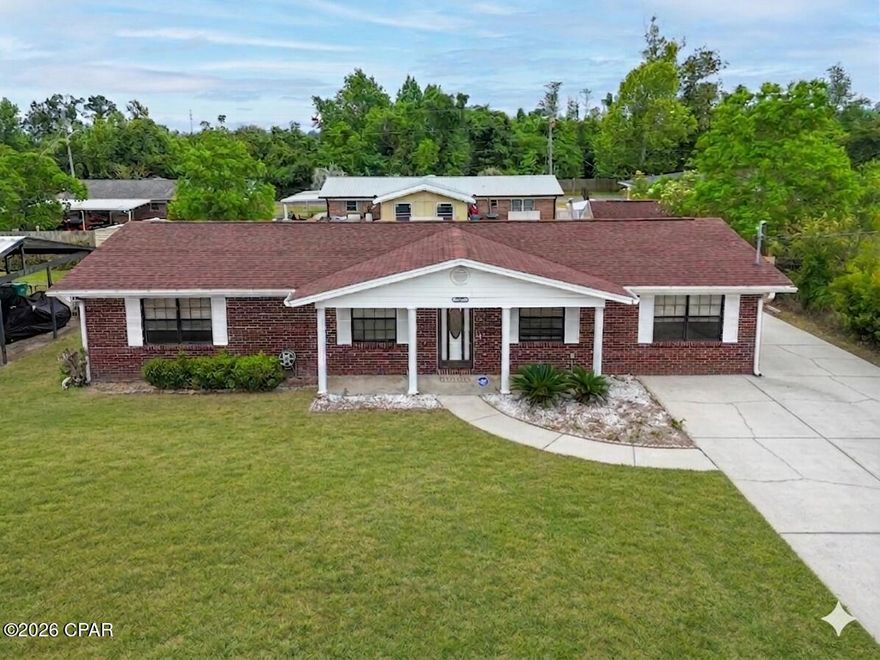 The Ultimate Move-In Ready Home.No HOA and no Flood zone. .Discover the perfect blend of durability and freedom in this stunning all-brick residence, meticulously maintained and ready for its next owner. Situated in a ''High and Dry'' non-flood zone area, this home offers incredible peace of mind with a roof replaced in 2019 (permit pulled) and a structural profile designed to breeze through a four-point inspection. At the heart of the home, the kitchen serves as a true centerpiece, featuring a functional island that provides extra prep space and a natural gathering spot for guests. Modern updates shine throughout the three-bedroom, two-bathroom layout, including brand-new flooring in two bedrooms and the versatile bonus room, ensuring a fresh, modern feel from the moment you walk through the door.

The exterior of the property is a true standout for those who value space and utility. The oversized driveway and expansive backyard, secured by a full privacy fence, provide more than enough room to park both an RV and a boat directly on your property without the restrictions of an HOA. For even more utility, the yard features a functional, oversized storage shed, perfect for housing tools, equipment, or outdoor gear. Enjoy quiet Florida evenings from the comfort of your screened-in porch, overlooking a massive yard that offers endless possibilities for outdoor living. While the home is conveniently connected to public utilities, a private well remains on-site, offering an efficient solution for lawn maintenance and irrigation.

Perfectly positioned for convenience, this home is located just a short drive from Tyndall Air Force Base and only 35 minutes from the world-famous white sands of Panama City Beach. This property represents a rare opportunity to own a home with maximum flexibility and modern comforts. Whether you are looking for proximity to the base or a spacious, updated home, this brick beauty is prepared to meet every need.Call to view today