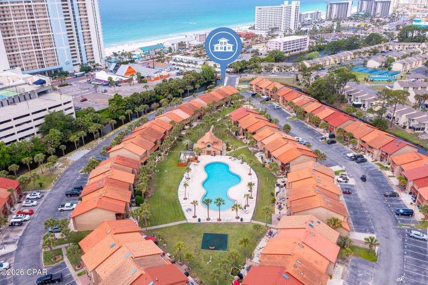 Welcome to the highly sought-after island section of Gulf Highlands Beach Resort! This unit at 223 Grand Island Blvd is ideally positioned as one of the closest properties to the pedestrian beach access, making your trips to the sugar-white sands quick and convenient.

The beach access is located just across Front Beach Road, and while it is a main roadway, the proximity from this unit makes getting there incredibly easy. Owners also have the added perk of being able to take and park a golf cart even closer to the access point, making beach days that much more effortless.

Located within the resort's unique island enclave, this section stands out with its coastal-style siding and signature clay tile roofs, offering a charming and distinct feel. Inside, the unit features LVP flooring throughout, a convenient half bath on the main level (perfect after beach or pool days), and sliding glass doors that open to your private patio just a short walk from one of the community pools and clubhouse.

Upstairs, you'll find two spacious bedrooms, each with its own en-suite bathroom, ideal for guests or maximizing rental potential. While the interior offers an opportunity for updates, the location and layout make this an incredible value.

Centrally located in the heart of Panama City Beach, you're just moments from Pier Park, Shipwreck Island Waterpark, and M.B. Miller County Pier, with endless options for dining, shopping, and entertainment along the Front Beach corridor. Whether it's a quick beach day, grabbing dinner, or enjoying local attractions, everything you need is right at your fingertips.

Gulf Highlands Beach Resort offers a gated, amenity-rich lifestyle with multiple pools, tennis courts, and one of the most convenient beach access points in the area.

Whether you're searching for a second home, investment property, or your own slice of PCB, this one checks all the boxes when it comes to location and potential.