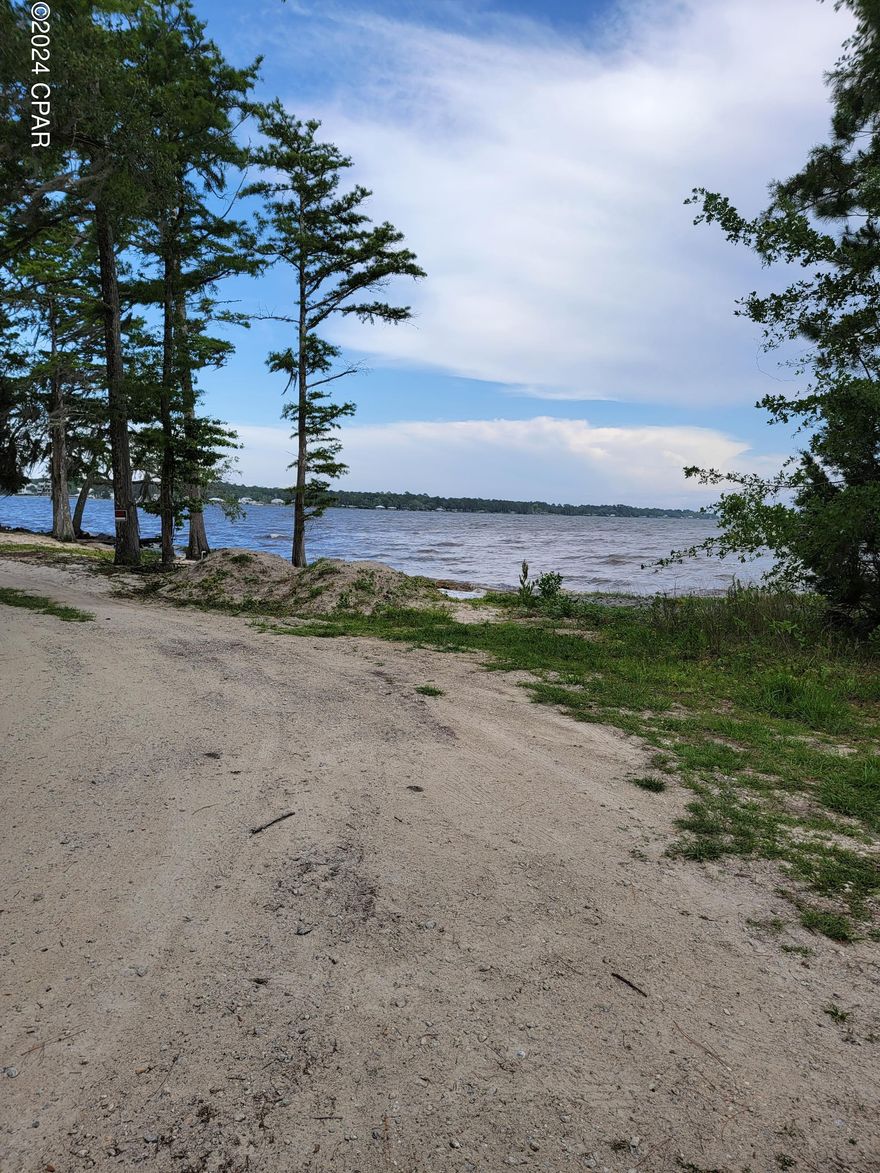 Lowest Priced, TRUE BAYFRONT, .35 +/- Acre Lot, anywhere in the area!!! This Beautiful Large Bay Front Lot has absolutely stunning views that are perfect for your New Home or Vacation Home! Million-dollar views at a fraction of the price and is close to the highly popular area of Santa Rosa Beach and all things fun!! You are just 20-30 minutes from anywhere you want or need to go! There is NO Association or Association Fees. This is a rare find in this market and will sell fast!! Great area & close to the beach, to all the attractions of 30-A, Destin, Panama City Beach, Airports and yet private and quiet away from the traffic and hustle/bustle of it all!! Survey available upon request. Must see, as it is exquisite!