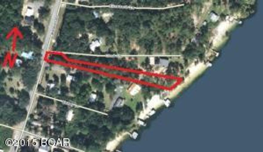 BEAUTIFUL LOT on the West side of Compass Lake with 80 feet of prime waterfront. Clean Clear Water with White Sand Beach for Swimming, Skiing, etc.