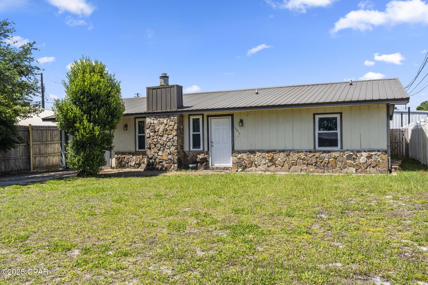 Don't miss this charming 2 bedroom, 2 bathroom house in prime Panama City Beach - just a mile from Pier Park and a quick walk or drive to the Emerald Coast. Close to shopping, eateries, and entertainment - including the new McGuire's and Dolly Parton's Pirate Voyage! In the bright, coastal kitchen, you'll find updated appliances and plenty of cabinets for storage space! Both bedrooms are a nice, large size. The master bedroom has a private bathroom, and the additional bedroom shares the hallway bath. The cozy living room is perfect for relaxing after a day at the beach. From the nice size dining room, a large window overlooking the backyard brings in great natural light. The large, fenced backyard provides ample space for enjoying the Florida sunshine or watching your pets play! Fantastic primary residence or rental property.
The home boasts a single car garage which attaches to the laundry room, where both the washer and dryer will be staying with the property! 
All new windows and a new HVAC were installed in 2022. New electrical panels.