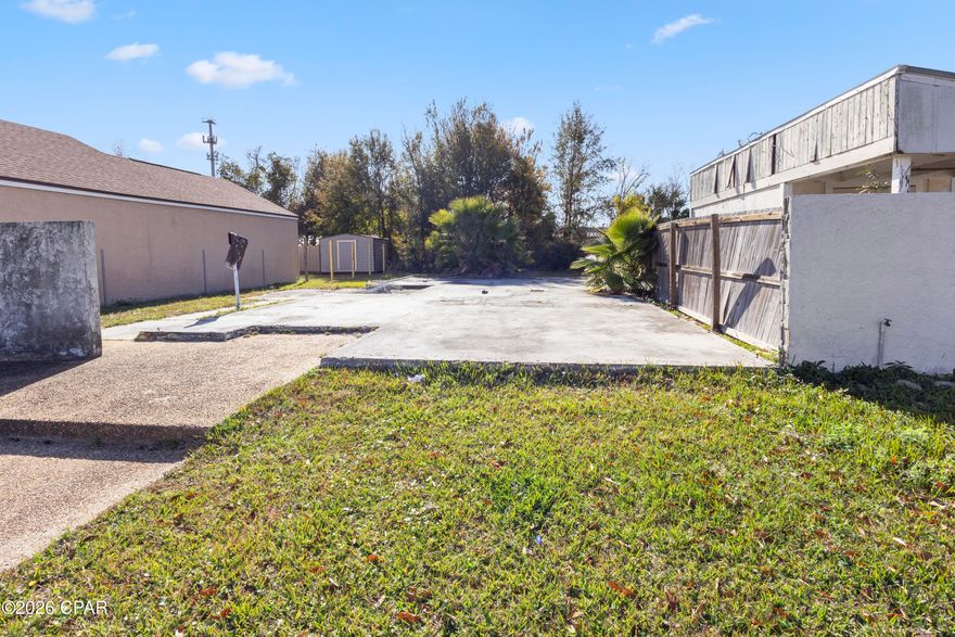 Residential city lot located on Pridgen Street, conveniently situated within the Panama City area. This .10-acre parcel is improved with an existing concrete slab and has utilities available, offering a strong starting point for new construction. Set in an established neighborhood with surrounding homes, the lot is well suited for a single-family residence.