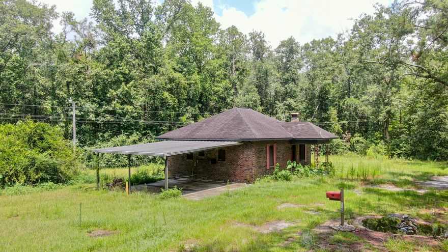 Over 13ac with Hwy Front on 2 Highways and an unpaved Road! This 3 Bedroom, 1.5 Bath Home is a great starter or and Investors Dream!