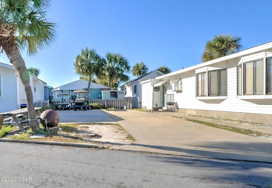 Check out this rare opportunity to own your own stunning waterfront lot in popular Venture Out.  Build on this gorgeous lot or bring your RV.  This one won't last long as these lots are highly sought-after and rarely find their way to the market. Finally, your chance to live the Grand Lagoon waterfront lifestyle you have been searching for! Venture Out offers BOTH beach and bay access! The resort also has 2 pools, tennis, golf, shuffleboard, playground, basketball, fishing pier, boat dock with slips & boat ramp. Venture Out is a golf cart community that has exploded in popularity within the last few years. A gated community that's great for full time residency or just to vacation. 24-hour security & friendly atmosphere. It's all here!!