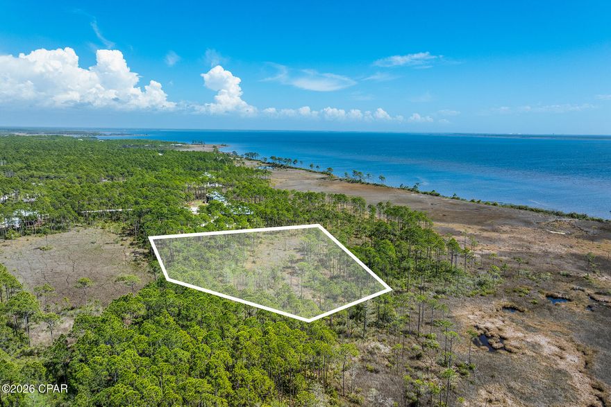 1.29 acre waterfront end lot with beautiful Bay views. If you have never been out to the St. Joe community, Rivercamps on Crooked Creek, you will be mesmerized! Surrounded by 3 bodies of water, Crooked Creek, the Bay and the Intercoastal Waterway, this peaceful community is a nature enthusiast and boater's dream. Plenty of space and privacy and yet so close to all the conveniences one could want; only 15 minutes to the beach or Pier Park with over 100 stores, eateries and entertainment, 10 minutes to the airport and the planned new hospital and Publix also within 10 minutes. Build your dream home on this prime 1.29 acre waterfront end lot with beautiful Bay views. No other homes will be built in front, behind or on the east side. Rivercamps owners and guests enjoy world class amenities not found in any other community.