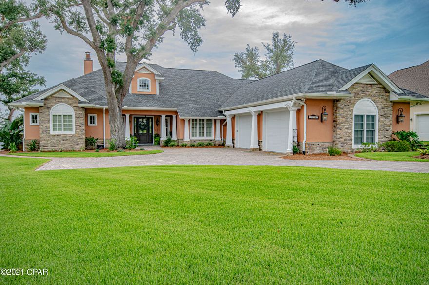 Luxurious picturesque waterfront home located in Cove Pointe. The oversized paver driveway leads up to a covered porch entry to the home. As you enter the home you have a full view of the stone pool and spa on Watson Bayou that will take your breath away. The warm and welcoming expansive great room has enough room for 2 sitting areas or a sitting area & dining area; includes a gas fireplace, hardwood floors, beamed coffered ceiling with crown molding, and glass sliding patio doors leading to the outside for entertaining. The fully equipped kitchen is a chef's dream. It features a built-in refrigerator, Jenn Air gas range with 2 ovens, griddle, pot filler faucet, under cabinet microwave, raised dishwasher, warming drawer, double and single porcelain farm sinks, granite countertops, extended breakfast bar, large island, wine and butler's pantry. Just off the kitchen is the laundry room with matching cabinets and conveniently located behind the double pocket doors with an expanded kitchen workspace, mudroom/laundry area, including desk area, open locker area, laundry tub, and refrigerator. Enjoy waterfront views and memorable meals in the dining area. A half bath is located off the breakfast nook & opens to the patio area for the convenience of those enjoying the outdoor spaces. The roomy master suite features a double door entry that separates the bedroom and bath with his and hers walk-in closets, tray ceilings, and private entrance to the pool area with large bay windows overlooking the water. The large master bath has separate dressing areas and his & her vanities with separate sinks. Enjoy a relaxing soak in the garden tub or a spa shower equipped with a rain showerhead. Off the kitchen is the beautiful decorative iron work staircase leading to the upstairs media center, additional bedrooms, one with a large walk-out covered balcony with a panoramic view of Watson Bayou, and a shared full bath. The breathtaking pool and spa area with the expansive outdoor living space is an extension of the home with many features that enhance luxurious living. The nicely landscaped yard terraces down to the waterfront and dock where you can enjoy swimming, fishing, paddle boarding or waterskiing. This home features Smart Home technology with surround sound, security system with cameras, intercom system and interior/exterior music system.