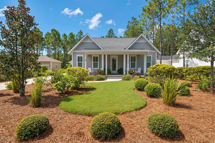 BREATHTAKING WATERSOUND ORIGINS OASIS with curb appeal galore! A welcoming rocking chair porch leads you onto gleaming hardwoods and a wealth of bright open spaces and fine finishes. Gourmet kitchen features breakfast bar, granite counters, stainless steel appliances with view to dining and great room with fireplace. Serene owners suite with spa bath, nicely appointed secondary bedrooms and baths, one has a built-in desk and sitting area and another near foyer offers french doors perfect for parlor or home office. Incredible covered deck with stone fireplace and room for entertaining and relaxing. Custom tiered POOL with spa, spacious premium decking. Detailed privacy fence overlooks wooded landscape. Detached 2 garage with great storage. MOVE-IN READY and a MUST SEE!