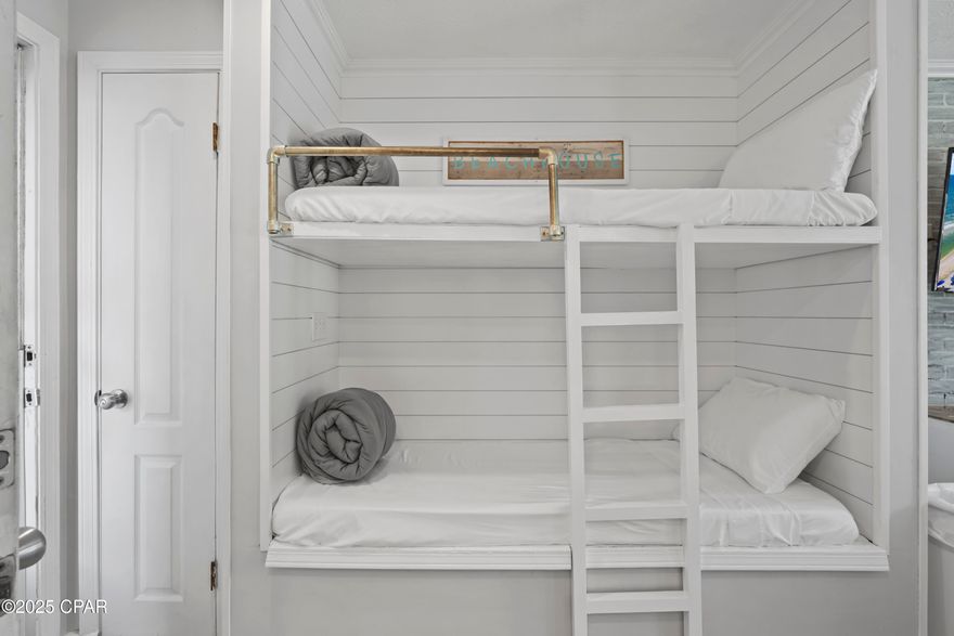 Perfectly Adorable & Modern Studio in Gulf Highlands Beach Resort

Welcome to your charming slice of paradise in the heart of Panama City Beach! This beautifully updated studio retreat in the sought-after Gulf Highlands Beach Resort is the perfect coastal escape or investment opportunity—brimming with modern touches and beachy charm, not to mention a rental machine.

Step inside this thoughtfully designed ground-floor unit—no elevators or stairs to worry about—and fall in love with its fresh, stylish updates. A custom accent wall adds a touch of personality, while a sleek backsplash and modern bathroom renovations elevate the overall look and feel. Coastal-inspired décor and clever use of space, including built-in bunk beds, make this studio as functional as it is fabulous.

Located within a gated, pet-friendly community, this resort offers an unmatched list of amenities. Enjoy 11 sparkling pools (including 5 heated), pickleball, tennis, and shuffleboard courts, fitness center, playgrounds, and even an 18-hole mini-golf course—all nestled within beautifully landscaped grounds. There are three gated entrances for easy access and even a private gate that connects directly to Edgewater Shopping Center and Rock-It Lanes—bowling, arcade, and family fun just steps from your door.

Golf cart friendly and walkable, Gulf Highlands boasts a Privately Owned Beach House with a pool right on the Gulf, just a quick golf cart ride away. Spend your afternoons lounging at the beachside pool, dining on the upper deck café, and catching unforgettable sunsets over the emerald coastline. With private beach access, you can dip your toes in the sugar-white sand anytime you please.

Situated in the hub of the beach, you're within walking distance of local restaurants, grocery stores, banks, post office, medical centers, and Shipwreck Island Water Park. Plus, it's just a short drive to Pier Park, sports complexes, military bases, and the airport.

Whether you're looking for a relaxing beach getaway, a short-term rental opportunity, or a place to call home—this updated, ground-floor studio checks every box. Don't miss your chance to own a piece of Gulf Highlands magic!