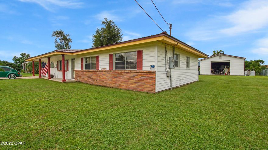 This very well built 3BR/2BA home not only has an amazing well established yard but includes an amazing 25x40 workshop perfect for any hobbyist or DIY enthusiast, on .49 acre that gives you plenty of room for a boat, trailer, camper etc. Workshop has a roll-up door, AC, 220 amp power, also wired for cable and plumbed for a bathroom. Property is close to shopping, schools and less than 9miles to Tyndall AFB. The metal roof and heat pump are approx 3 years old, the home is all electric and on city water and sewer. Please verify measurements if important.