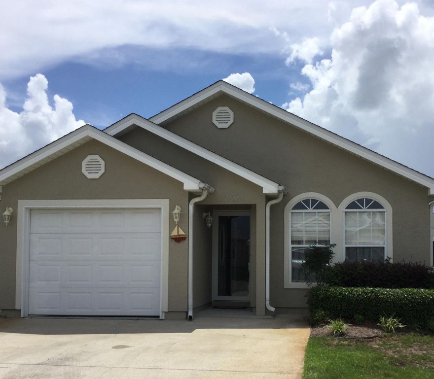 Immaculate two-bedroom / two-bath original owner, second home.  Never rented and in excellent move-in condition.  Being sold FULLY FURNISHED! To include ALL furniture, linens and kitchen items.  Exterior recently painted – AC is two years old.  Dishwasher is one year old.  One car garage and large screened back porch.  The open floor plan compliments a relaxed living theme with large and airy rooms throughout the home. The home is located in a great location within the Palm Cove community. You really need to see this home to appreciate its tasteful decorating and overall condition. Palm Cove is a gated community with pools, playground and, grass mowing by the Owners Association for low maintenance ownership! All measurements, dimensions and age are approximates.