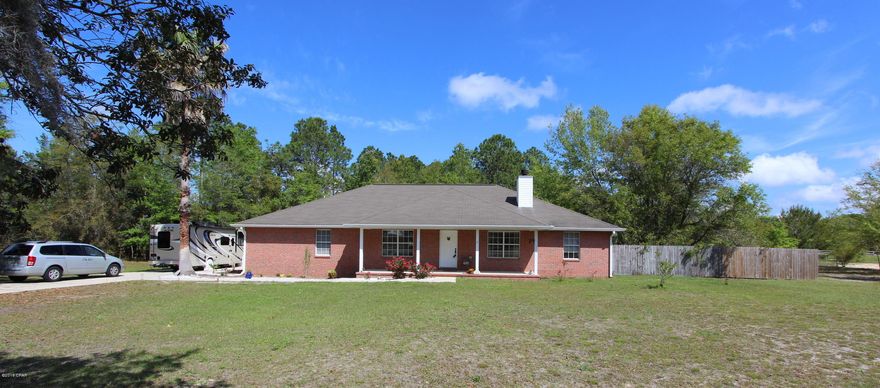 Do you need room for your boat/RV or other items but still want to be close to town - this is the house! This lovely home is very convenient to shopping and restaurants but in a rural setting on almost 3 acres with pond access. It's features a split bedroom plan with an open living/dining concept for enjoyable living. The kitchen has lots of cabinetry & counter space as well as a pantry and the newer SS appliances all convey including a convection oven w/warming drawer and French door refrigerator.  Just off the kitchen is the laundry room with washer/dryer & freezer that all convey. The living room has a vaulted ceiling, wood burning fireplace and built-in shelving and has views across the street to Deer Pt Lake. Out back is a nice covered porch with fans and views of the wooded backyard. Part of the lot is fenced but there are trails and open areas for playing/gardening or setting up a fire pit by the pond for roasting marshmallows or just enjoying a beverage.  There's a raised enclosed bedding area for planting, numerous fruit trees & wild berries for gathering. Another outdoor feature is the enclosed shower and potting area. The garage is spacious and features an attached air conditioned room with a 220 outlet, laundry sink and lots of storage.  It would make a great office, he/she cave or craft room.  The seller's have put lots of sweat equity and love into the home including installation of gutters, replacing the flooring, new appliances including washer/dryer, new kitchen sink, installed new disposal, replaced 3 ceiling fans, and replaced the door trim in numerous locations all in 2015. They also cleared lots of brush/small trees and planted 8 fruit trees and other blooming plants.  Quiet country living is easy to achieve with this wonderful home - call today to make it your own.